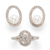 A DIAMOND AND FOURTEEN KARAT W