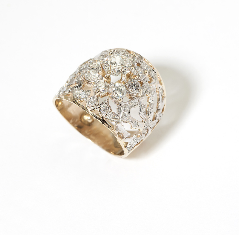 A diamond and gold wide band Tested