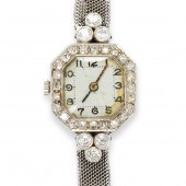 A DIAMOND AND PLATINUM WATCH B