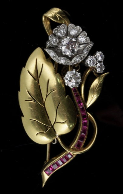 A diamond and ruby set foliate