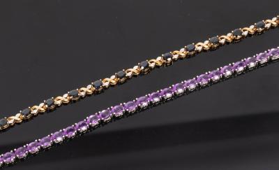 A diamond and sapphire bracelet set