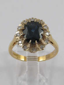 A diamond and sapphire cluster ring