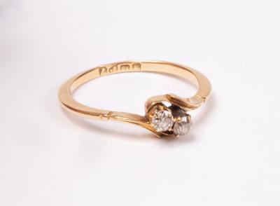 A diamond crossover ring, set in