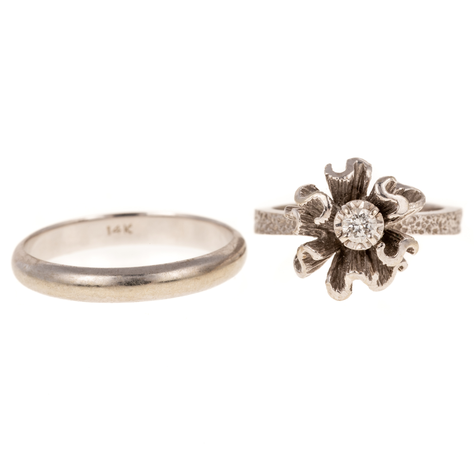 A DIAMOND FLOWER RING & WEDDING