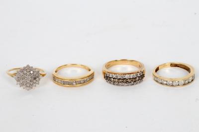 A diamond half-hoop ring, size N