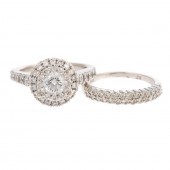 A DIAMOND HALO RING & BAND IN