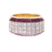 A DIAMOND & RUBY BAND IN 18K B