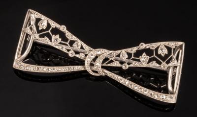 A diamond set bow brooch of