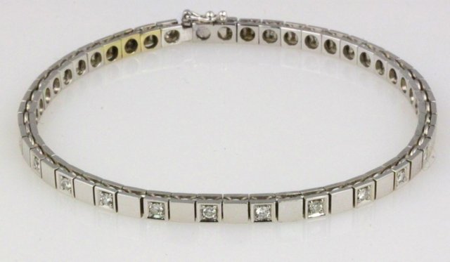 A diamond set bracelet set in