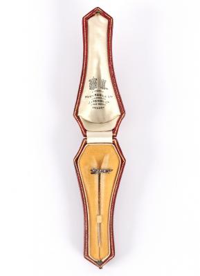 A diamond stick pin with fox