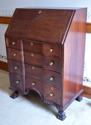 A diminutive antique slant-lid