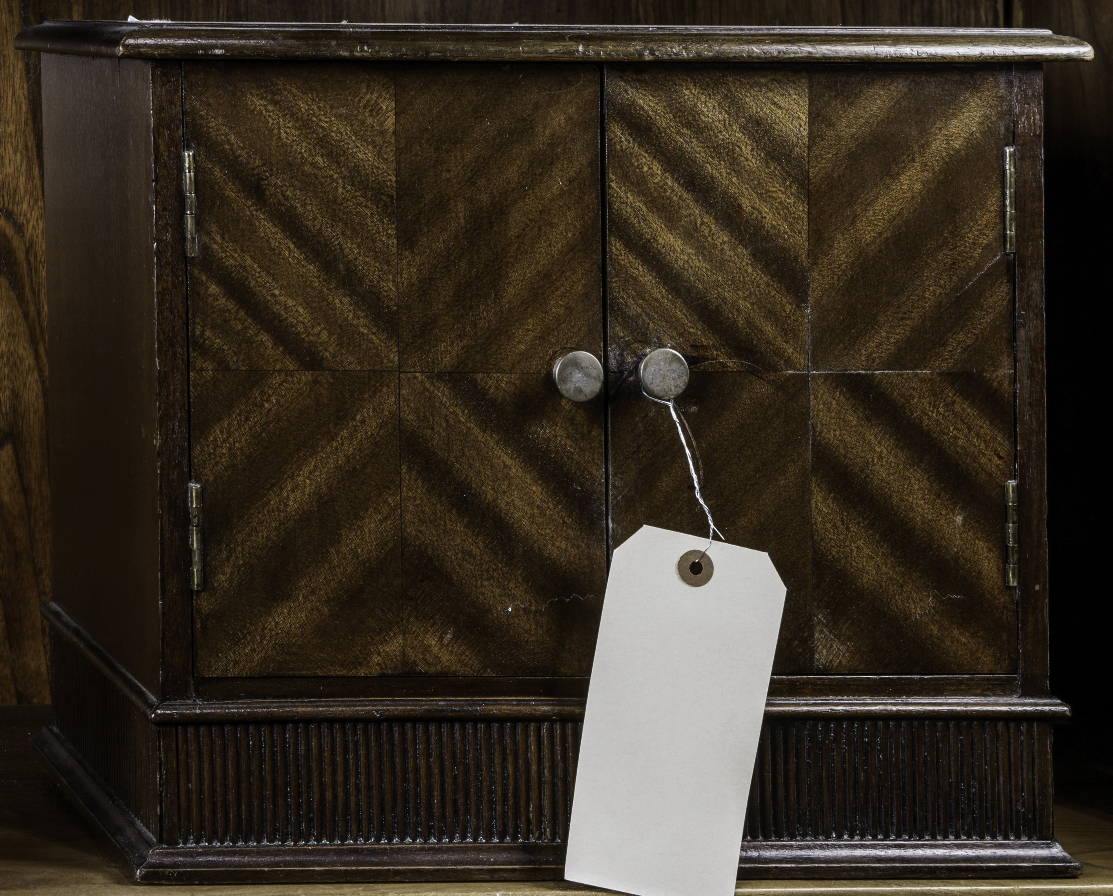 A DIMINUTIVE COLLECTORS CABINET A