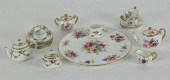 A doll's part tea set by Minto