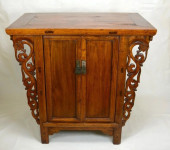 A DOUBLE-DOOR WOODEN CABINET W