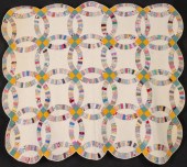 A DOUBLE WEDDING RING QUILT IN