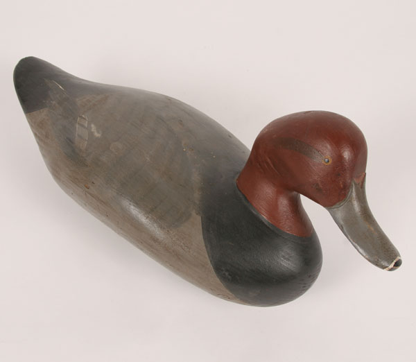 A duck decoy signed and dated "R.