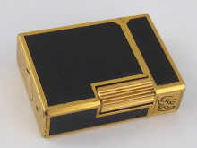 A Dupont gas lighter with black