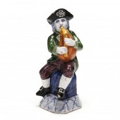 A DUTCH DELFT FIGURE OF A BAGP