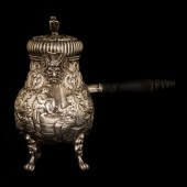 A DUTCH SILVER HOT MILK JUG A