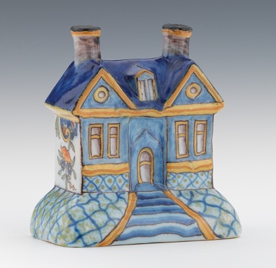 A Faience House Shaped Bank Hand