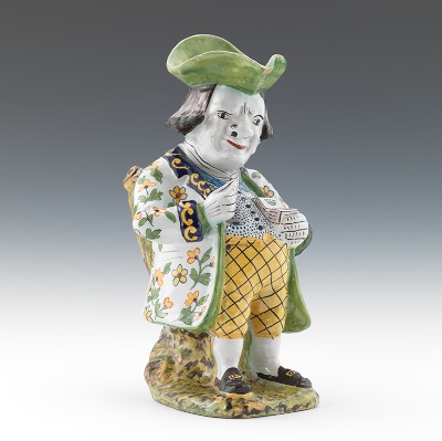 A Faience Snuff Taker Shaped