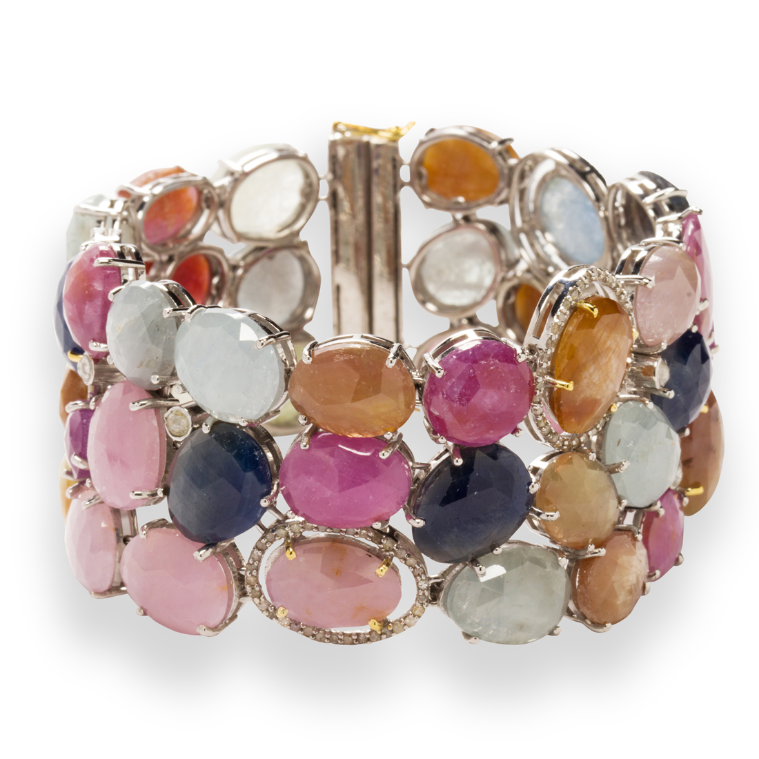 A FANCY COLORED SAPPHIRE AND