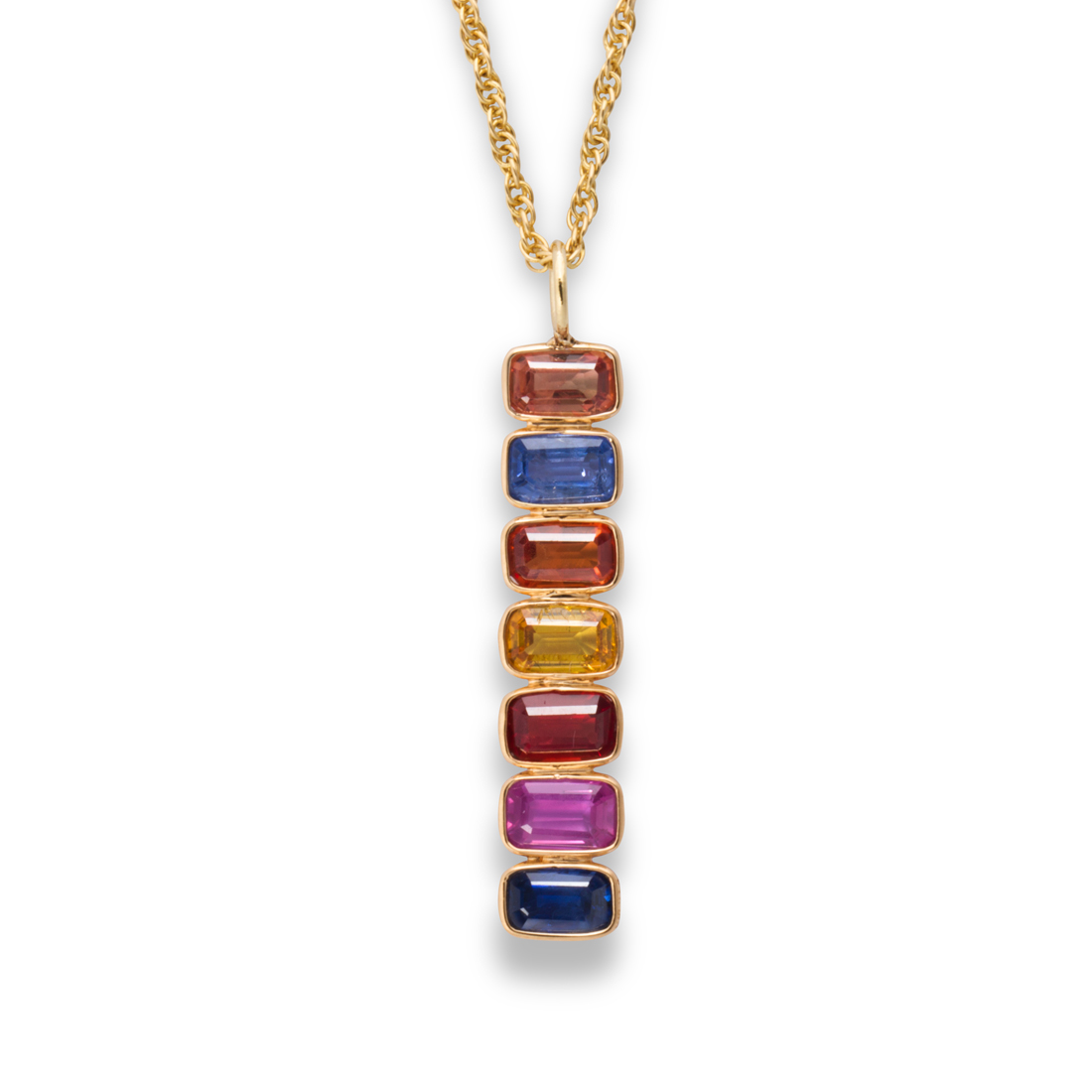 A FANCY COLORED SAPPHIRE AND GOLD
