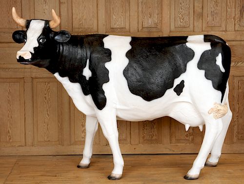 A FIBERGLASS FIGURE OF A COWA