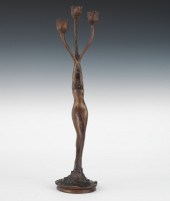A Figural Bronze Candleholder