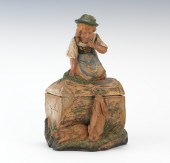 A Figural Humidor with a Young