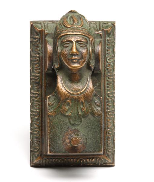 A FIGURAL PATINATED PAPER EMBOSSING