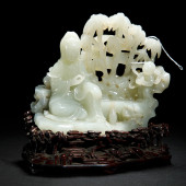 A FINE CARVED JADE GUANYIN AND
