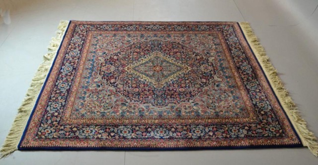 A FINE HAND-MADE WOOL PERSIAN