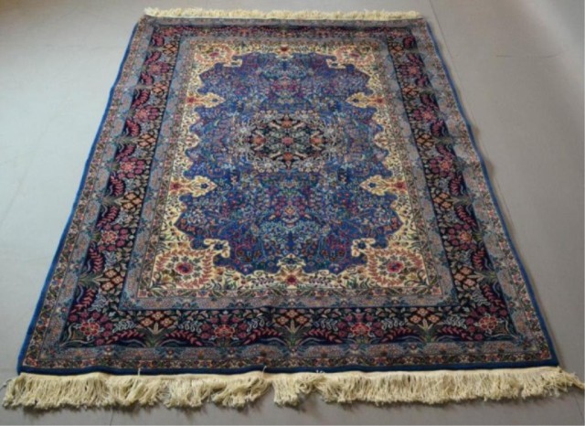 A FINE HAND-MADE WOOL PERSIAN