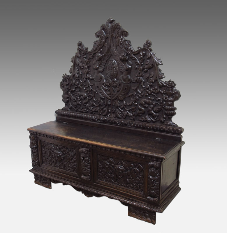 A FINE ITALIAN CARVED WALNUT