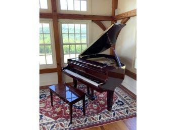 A fine mahogany case baby grand