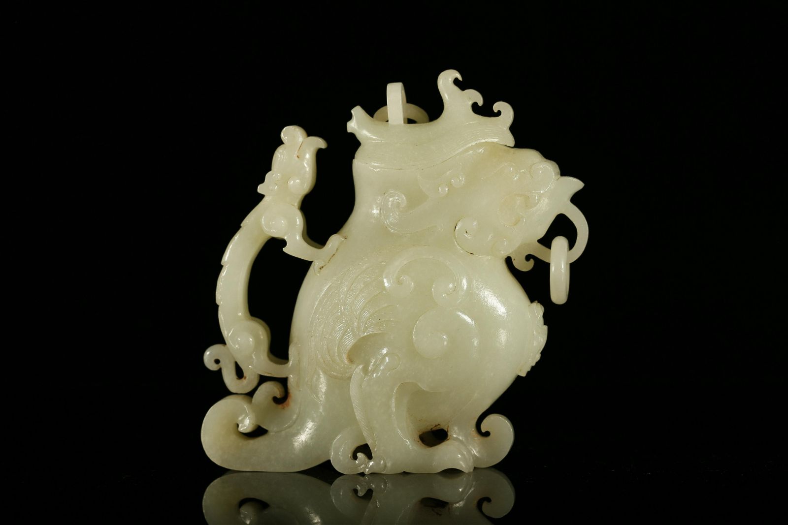 A FINE WHITE JADE 'BEAST' ZUNA Fine