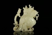 A FINE WHITE JADE 'BEAST' ZUNA