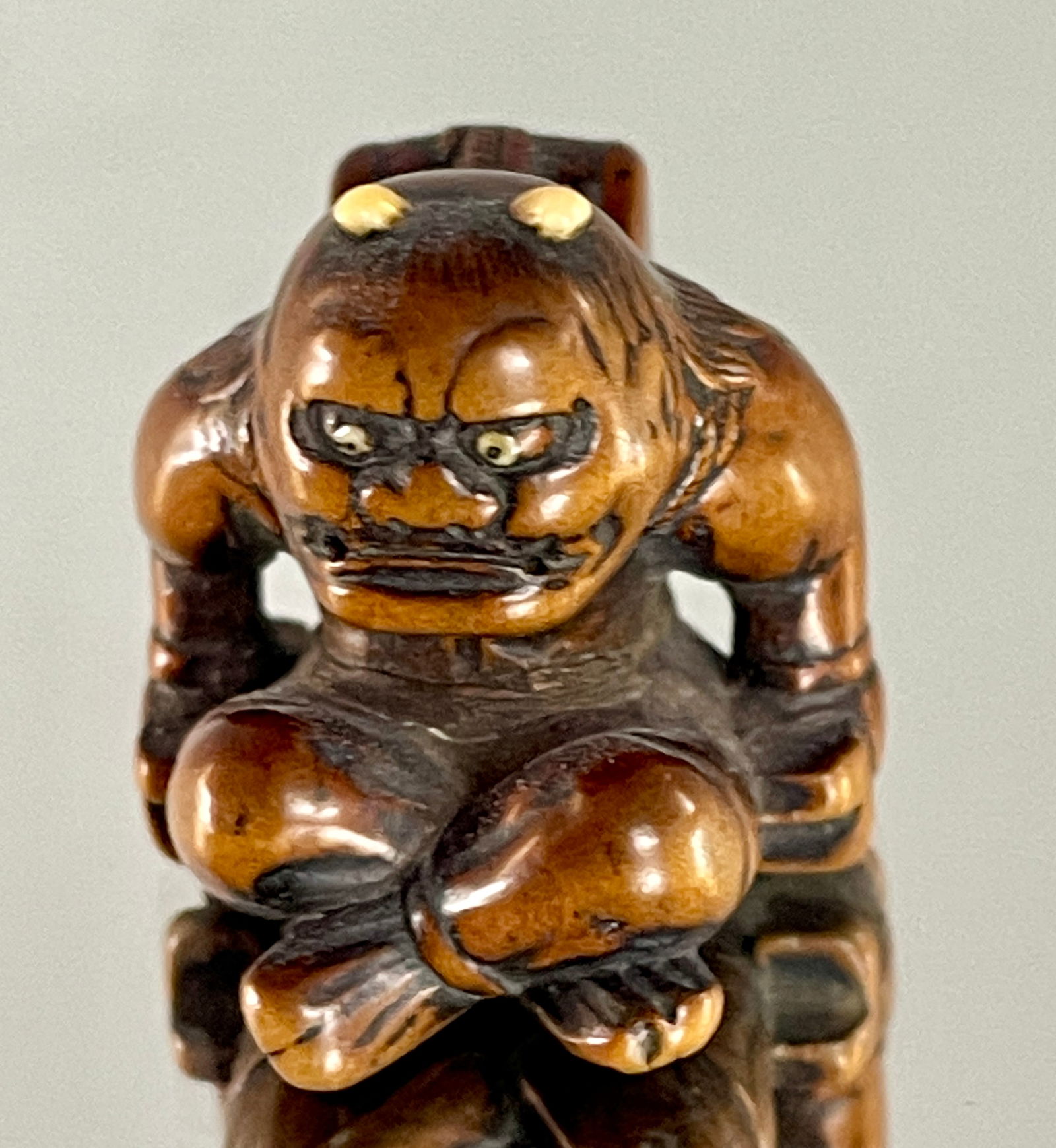 A FINE WOOD NETSUKE OF RAIJIN