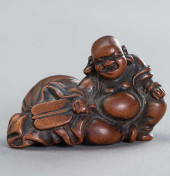 A FINE WOOD NETSUKE<br>The pot
