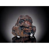 A finely carved wood Shishi Li