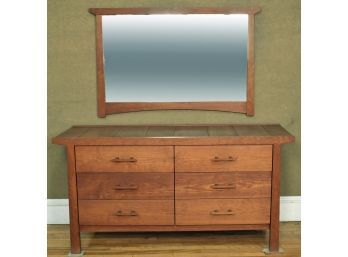 A finely crafted cherry low dresser