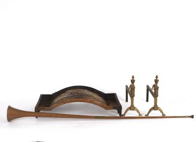A fire grate on a pair of brass