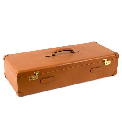 A fitted leather shotgun case for