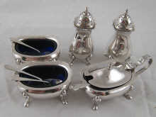 A five piece silver condiment set