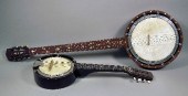 A five string banjo in oak fin