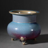 A FLAMBE GLAZED PORCELAIN TRIP