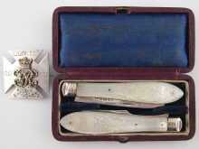 A folding fruit knife and fork
