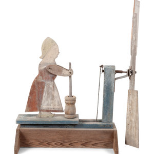 A Folk Art Carved and Painted
