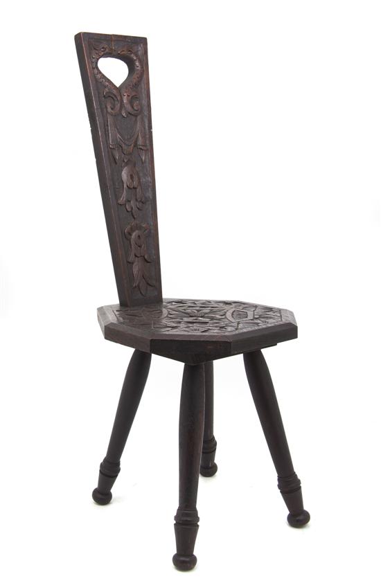 A Folk Art Carved Child's Chair the